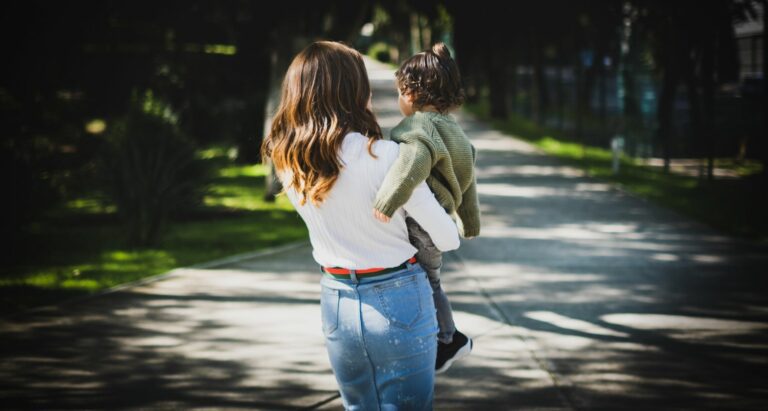 Jewish Divorce - Woman holds child in park
